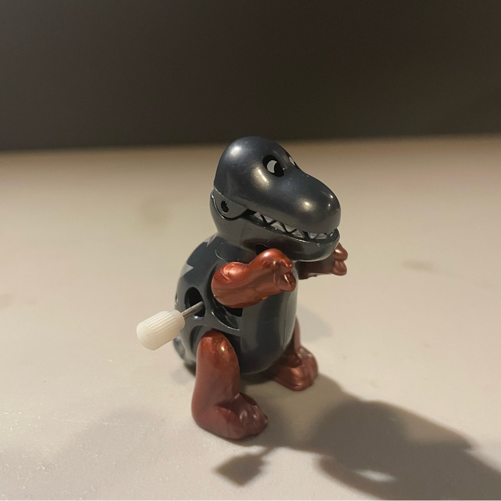 Wind up gray dinosaur